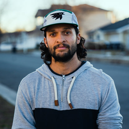 Man wearing adventure hat from Squak Mountain Co. that goes well with micro grid fleece hoodie.